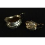 An Edward VII hallmarked silver cream jug with, Birmingham 1906, 86g gross weight, together with a