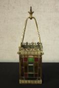 A late Victorian Arts & Crafts brass and stained glass hanging hall lantern. H.63cm.