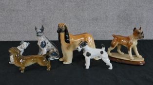 Assorted porcelain model dogs to include Bing & Grondhal, Lladro and other makers. H.15 W.16 D.7cm