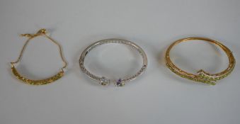 Two gem set bangles and a bracelet. One chrome pierced design bangle set with amethyst, peridot