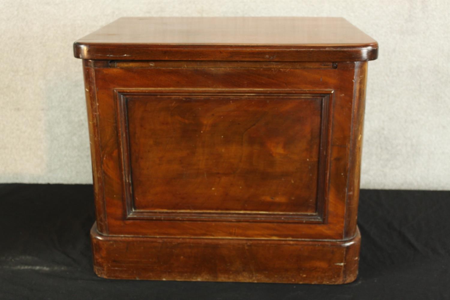 A 19th century mahogany comode with hinged lid opening to reveal open arm open seat. H.48 W.56 D. - Image 2 of 4