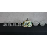 Assorted glass light shades to include a Tiffany style leaded glass light shade, a set of four