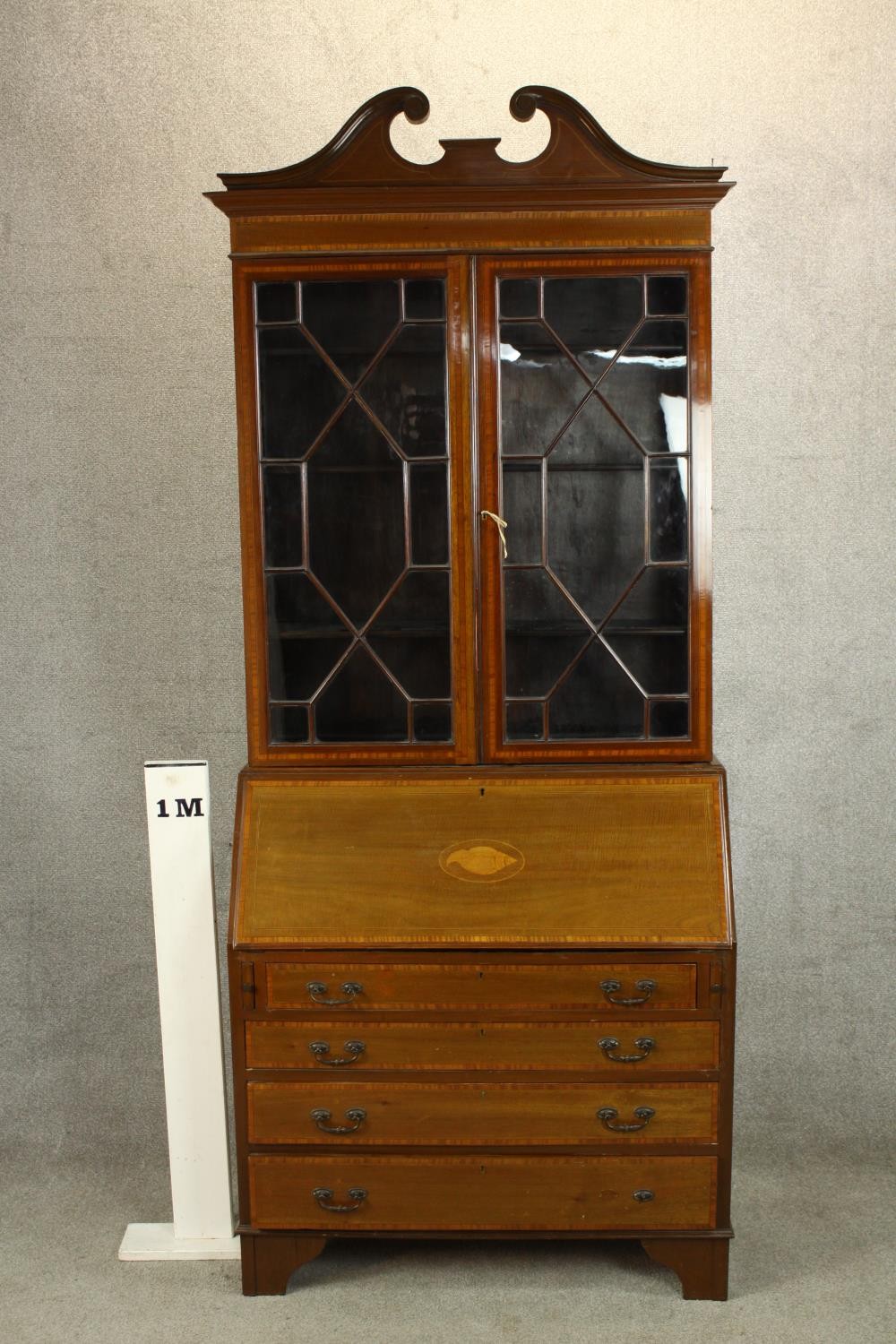 An Edwardian inlaid mahogany bureau bookcase with broken swan neck pediment, the twin doors - Image 2 of 6