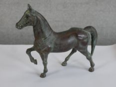A solid bronze horse. French. Circa 1920. H.19 x W.22 x D.7cm