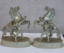 A pair of 20th century painted spelter Marly horses, each raised on oval bases. H.21 W.18 D.8cm