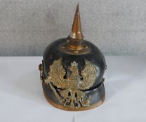 A World War I Imperial German Prussian Infantry pickelhaube, with black leather body mounted with