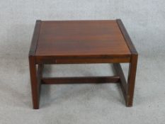 A 20th century mahogany low square topped coffee table raised on square supports. H.37 W.61 D.61cm