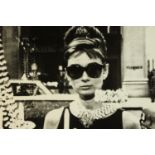 An unframed black and white photograph of Audrey Hepburn. H.80 W.80cm