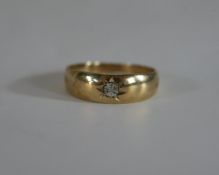 A 9ct gold diamond set band, the eight cut diamond in a star cut setting. Hallmarked:375, Sheffield,