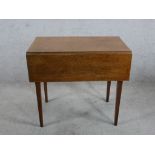 A 19th century mahogany Pembroke table, the single drawer with turned handles raised on square