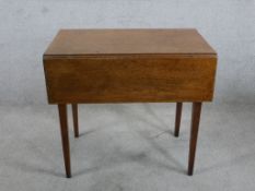 A 19th century mahogany Pembroke table, the single drawer with turned handles raised on square