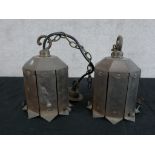 A pair of mid 20th century octagonal brass hanging light fittings. H.17 W.13 D.13cm