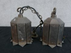 A pair of mid 20th century octagonal brass hanging light fittings. H.17 W.13 D.13cm