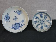 A 19th century Chinese blue and white porcelain saucer dish, decroated with panels of flowers bering