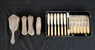 An early 20th century cased set of six fish knives and forks together with a cased set of four
