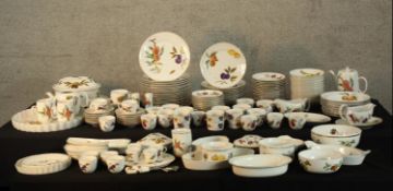 An extensive Royal Worcester Evesham pattern part dinner service to include plates, bowls, lidded