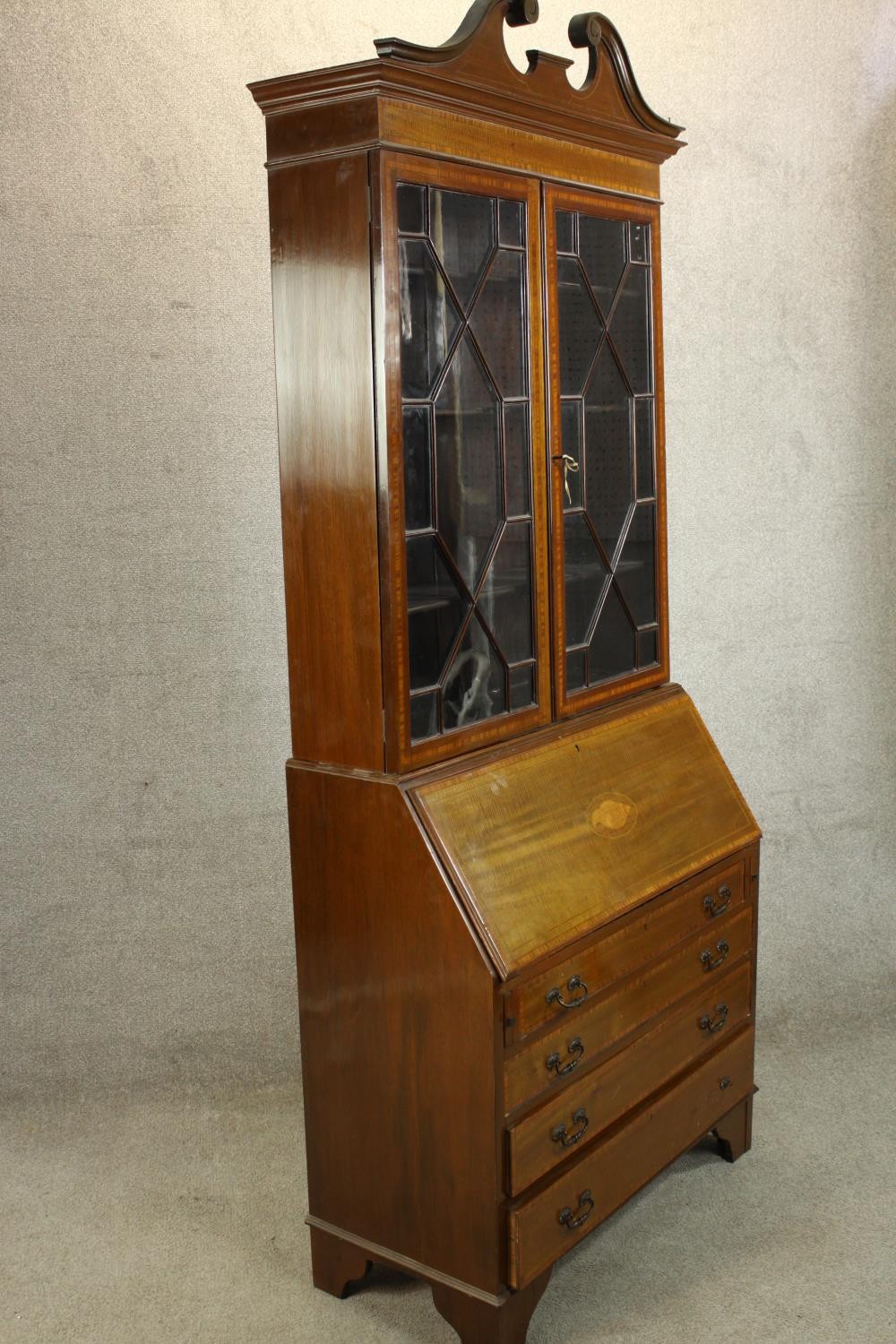 An Edwardian inlaid mahogany bureau bookcase with broken swan neck pediment, the twin doors - Image 4 of 6