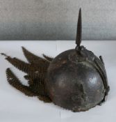 A 19th/early 20th century Indo-Persian steel Kulah Khud helmet. H.27 W.20 D.20cm