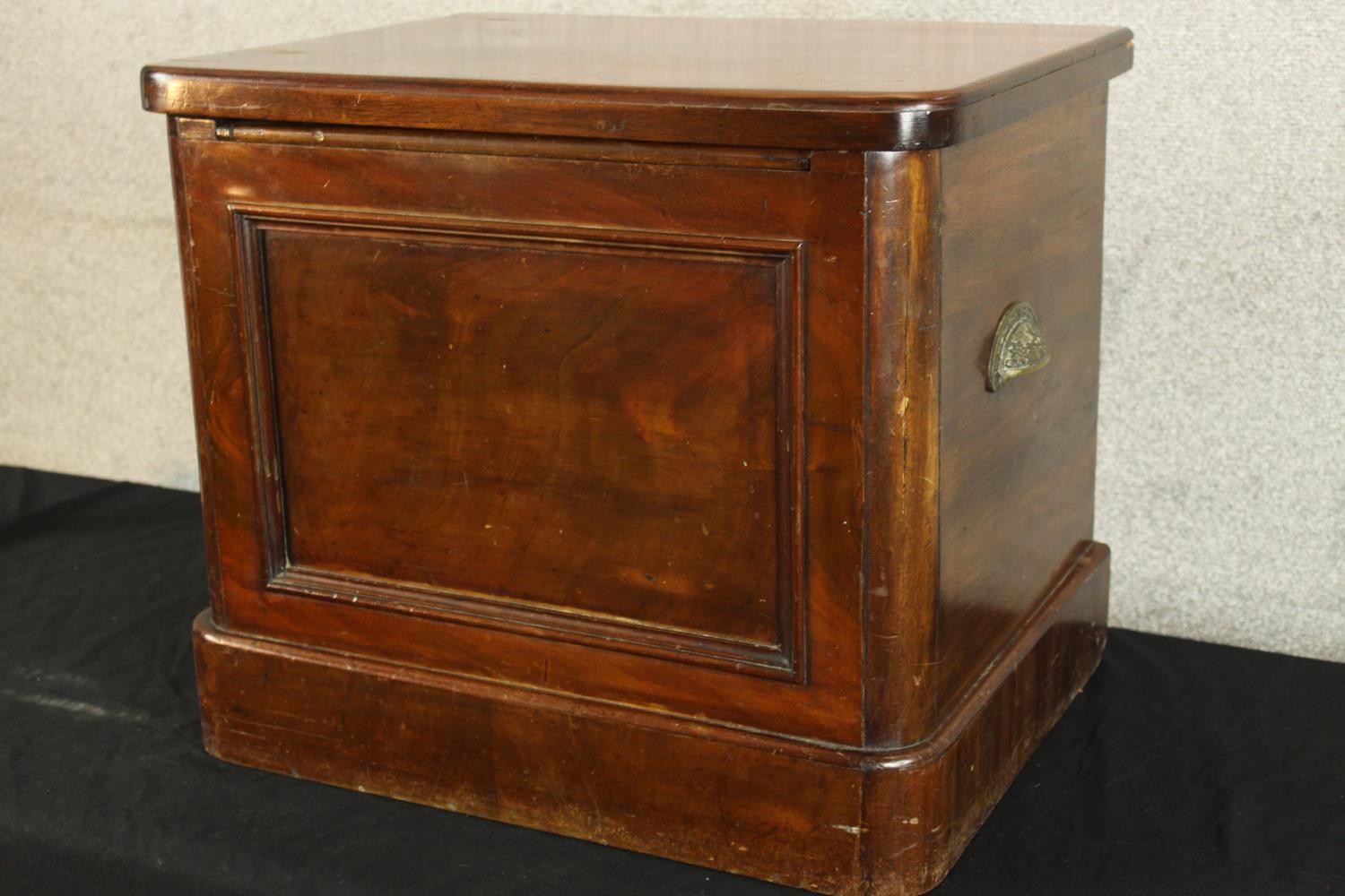 A 19th century mahogany comode with hinged lid opening to reveal open arm open seat. H.48 W.56 D. - Image 4 of 4