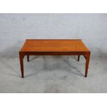 A 1960s/1970s Scandinavian teak rectangular table raised on square tapering supports. H.40 W.90 D.