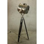 A vintage style floor standing lamp modelled in the form of a chrome plated theatre spot light