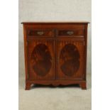 A contemporary Regency style twin door entertainment cabinet complete with with turntable, amp,