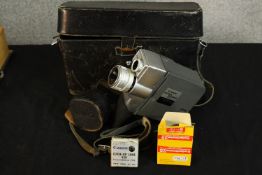 A mid 20th century cased Canon 8 camera together with a close up lens and other accessories. H.20