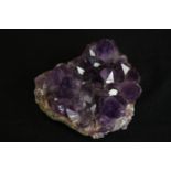 A piece of cut amethyst. L.12cm.