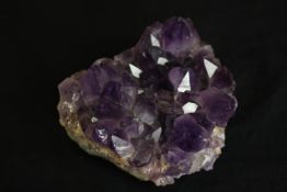 A piece of cut amethyst. L.12cm.