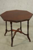 An Edwardian mahogany octagonal occasional table raised on turned and outswept supports. H.59 W.74