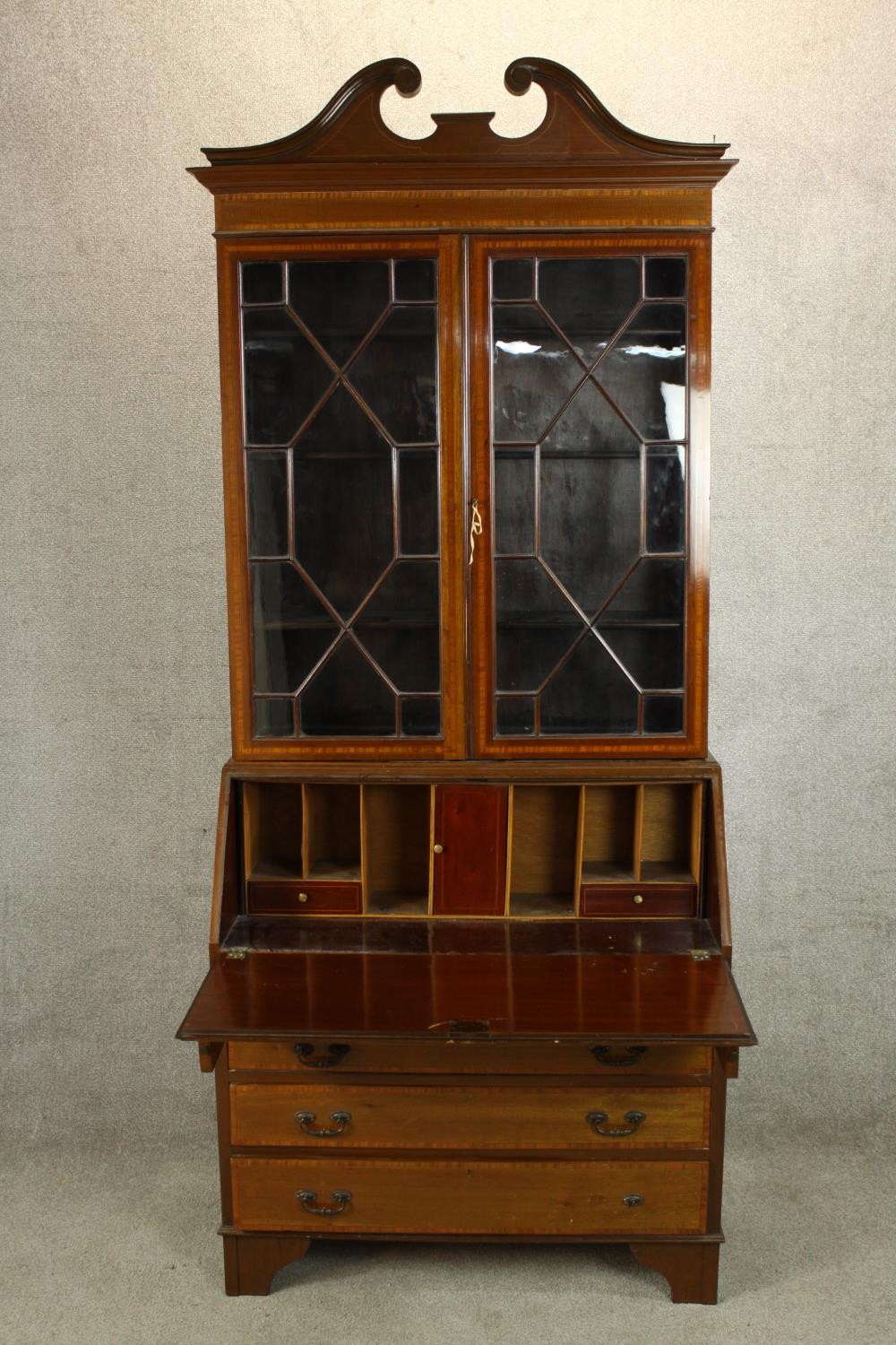 An Edwardian inlaid mahogany bureau bookcase with broken swan neck pediment, the twin doors - Image 5 of 6