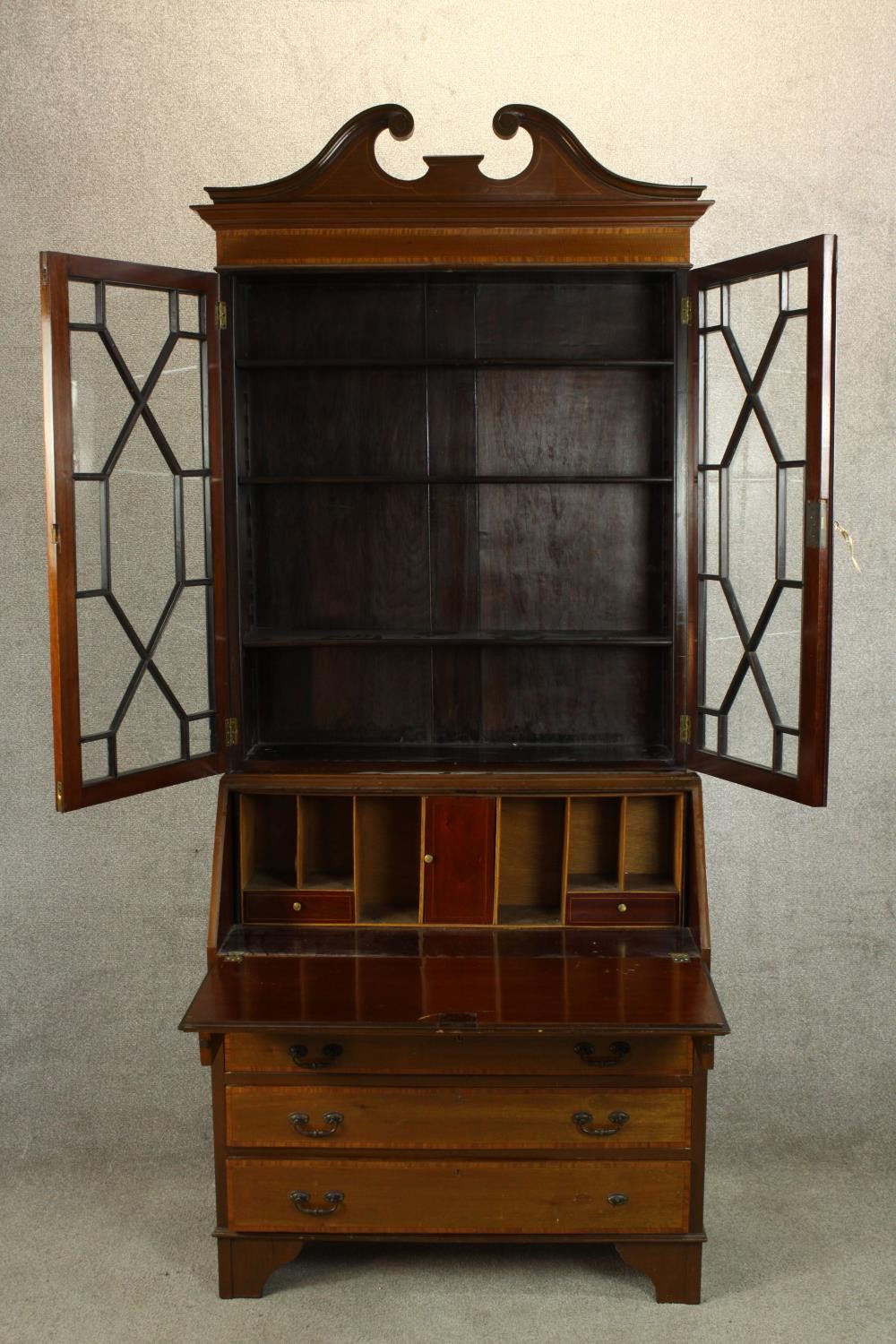 An Edwardian inlaid mahogany bureau bookcase with broken swan neck pediment, the twin doors - Image 6 of 6