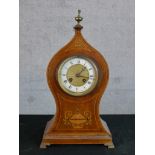 An Edwardian inlaid mahogany mantle clock, the enamelled dial with black Roman and Arabic numerals