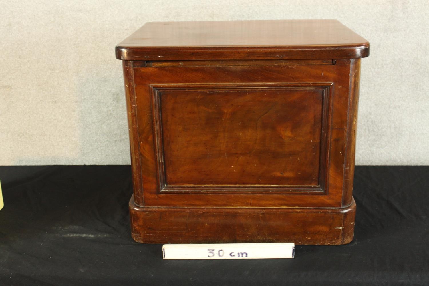 A 19th century mahogany comode with hinged lid opening to reveal open arm open seat. H.48 W.56 D. - Image 3 of 4