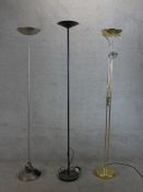 Three contemporary floor standing electric uplighters, one with adjustable reading light. H.187 W.26
