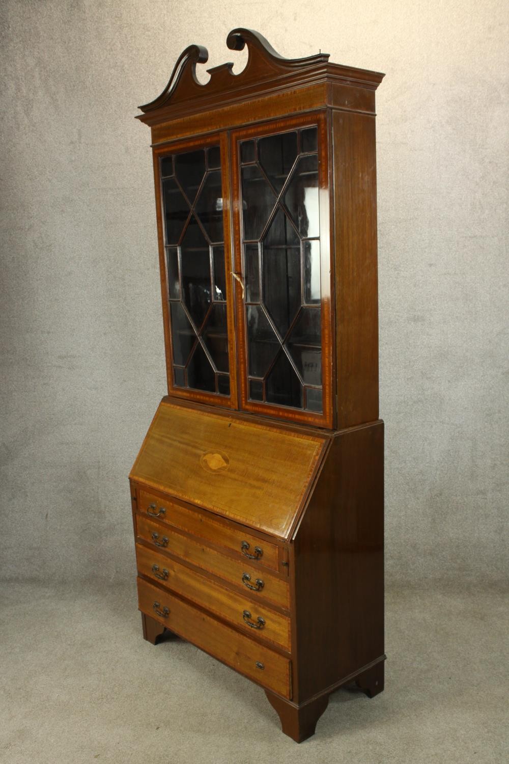 An Edwardian inlaid mahogany bureau bookcase with broken swan neck pediment, the twin doors - Image 3 of 6