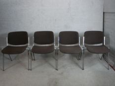 A set of four 1960s Giancarlo Piretti for Castelli aluminium and black upholstered stacking chairs.
