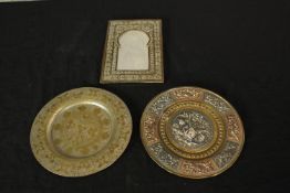 Two 20th century brass and copper trays together with a small engraved Indian brass picture frame.