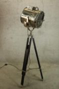 A vintage style floor standing lamp modelled in the form of a chrome plated theatre spot light