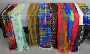 Eleven assorted vintage patterned silk scarves.