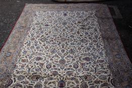 A large Persian Kashan carpet. H.416 W.315cm.