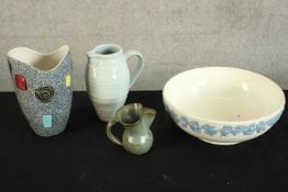 A collection of mixed porcelain to include three jugs and a Wedgewood bowl. largest H.20 cm.