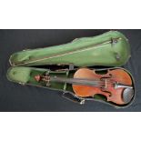 A cased late 19th century birds eye maple back full size violin, bearing label complete with bow.