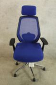 A contemporary blue fabric upholstered adjustable office chair raised on five splayed supports. H.