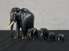 A set of five early 20th century carved ebony elephants. H.20 W.24 D.10cm