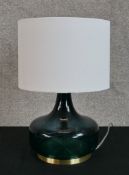 Contemporary table lamp made from green glass with gilded base. H.38 x W.25 cm.