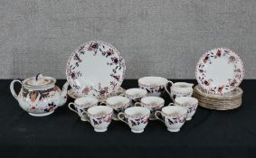 A ceramic tea set made by Grimwades Pottery and china plates made by Chelsea China. 23 cm largest.