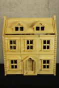 A well populated Doll's House. Fully furnished with two bedrooms and four dolls. H.74 x W.64 cm.