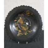 A late 19th/early 20th century Japanese black lacquered tazza decorated with a female in a garden