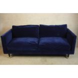 A contemporary blue upholstered two seater settee. H.71 W.200cm.